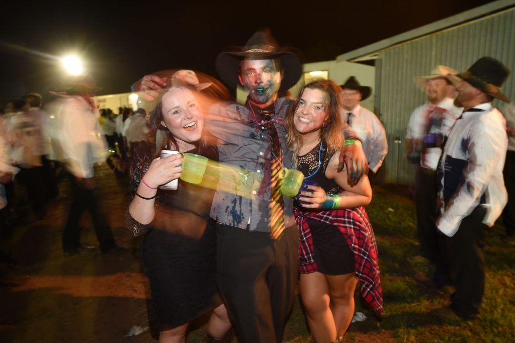 This photo taken on October 29, 2016 shows people partying at a "Bachelor and Spinster" ball in the town of Ariah Park in western New South Wales.  Pick-up trucks, cowboy boots and a 24-hour booze-fuelled party in the Outback: welcome to modern-day dating in Australia's bush, where swiping right is not an option. - TO GO WITH Australia lifestyle social dating, FEATURE by Glenda KWEK   / AFP / Peter PARKS / TO GO WITH Australia lifestyle social dating, FEATURE by Glenda KWEK