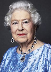 This photo by English photographer David Bailey of Britain's Queen Elizabeth II, taken for the GREAT campaign in 2014, and is now reissued Monday Feb. 6, 2017, by Buckingham Palace to celebrate her Sapphire Anniversary, marking the 65th anniversary of the monarch's accession to the throne. In the photo, the Queen is wearing a suite of sapphire jewellery originally given to her by her father King George VI as a wedding gift in 1947. (David Bailey via AP) MANDATORY CREDIT - NO USE AFTER TUESDAY FEBRUARY 7, 2017.