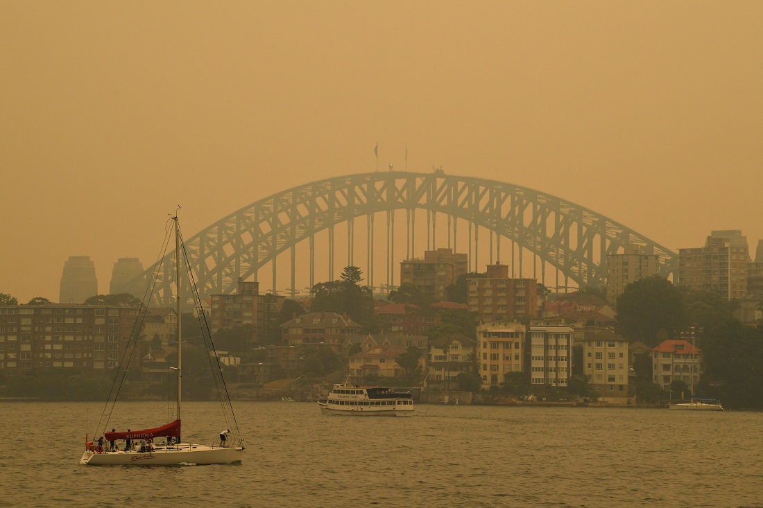 Sydney sous la suie, méconnaissable (Photo : DPA).